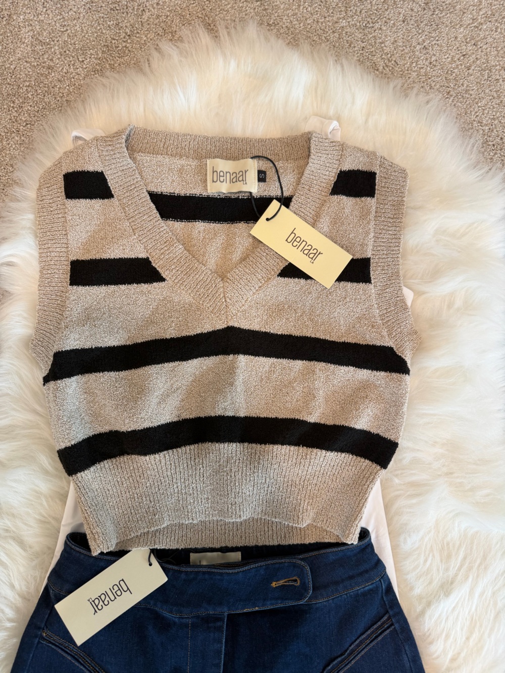 beige and black striped V-neck sweater vest